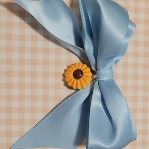 Blue Ribbon Clip with Cookie Charm